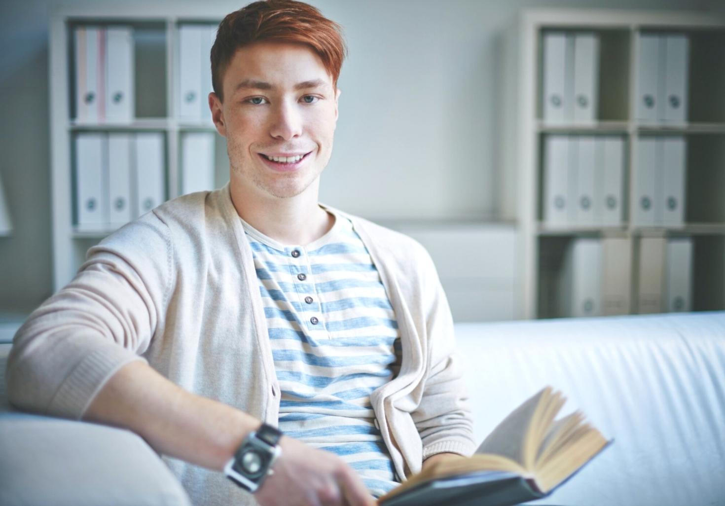 Person reviewing financial documents and taking notes